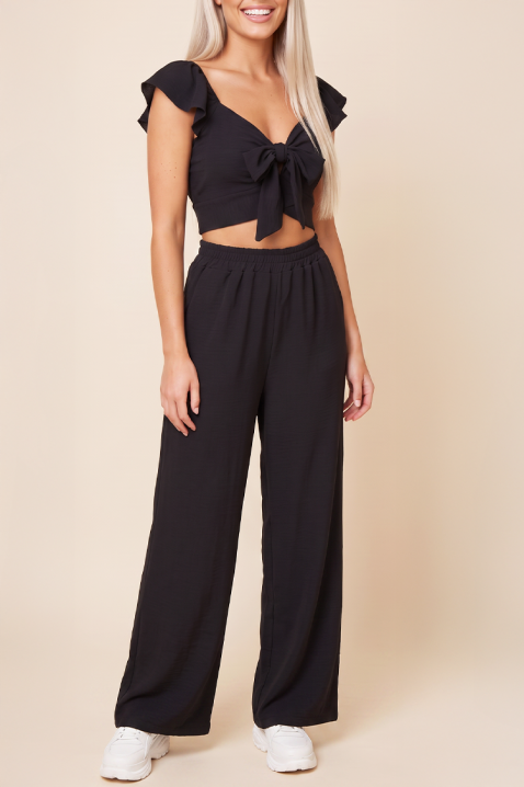 SVENSELA BLACK nyári, két részes női szett: bő szárú nadrág és megkötős crop top, Szín: fekete, IVET.HU - A te online butikod.